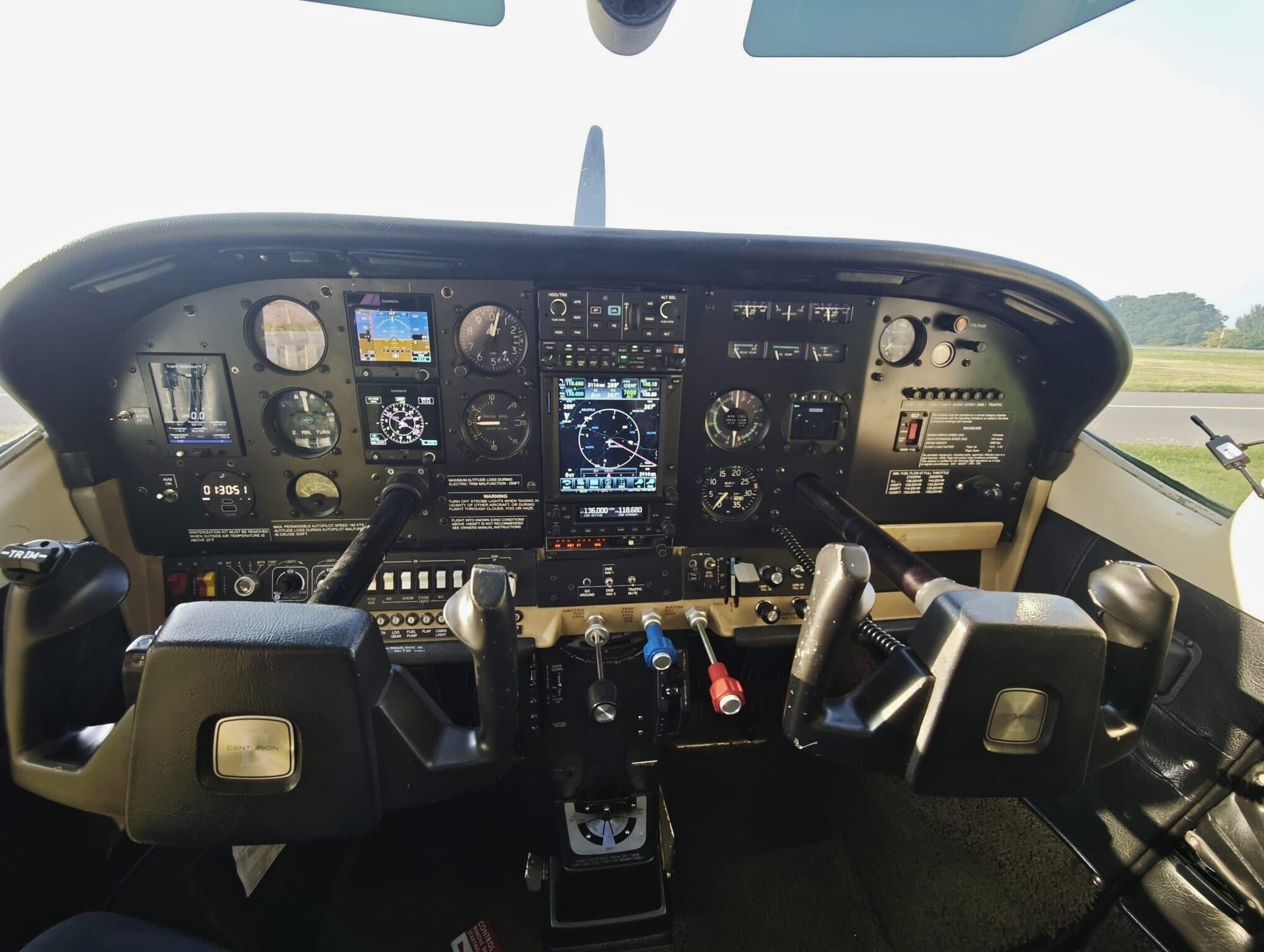 1975 Cessna C210L Centurion: Flight deck – Garmin GTN 750, dual G5, GFC 500